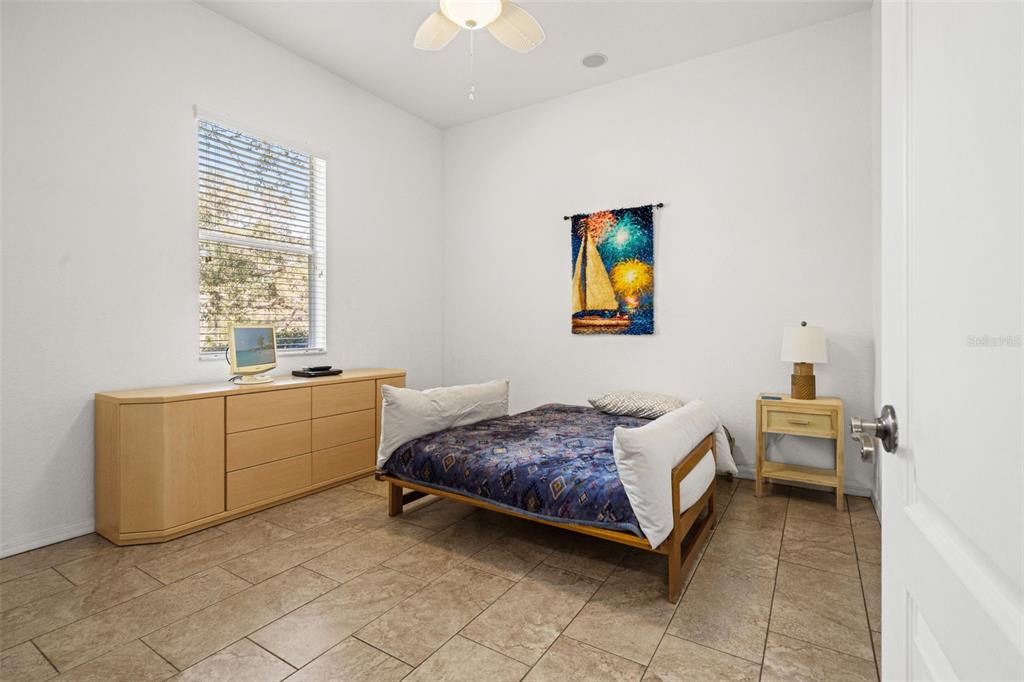 10288 Ridge Top Loop Weeki Wachee, FL 34613 - Photo 31 of 61 a room with a bed and a cabinets