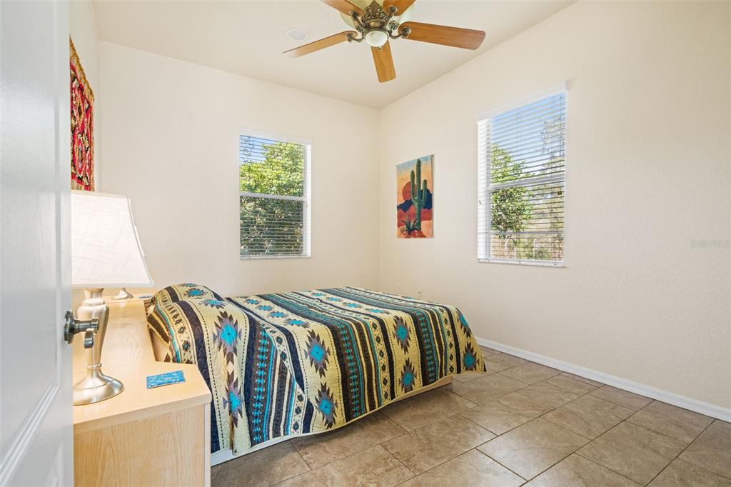 10288 Ridge Top Loop Weeki Wachee, FL 34613 - Photo 33 of 61 a view of a bedroom with bed and a window