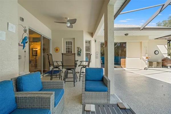 a view of a chairs and table in a patio