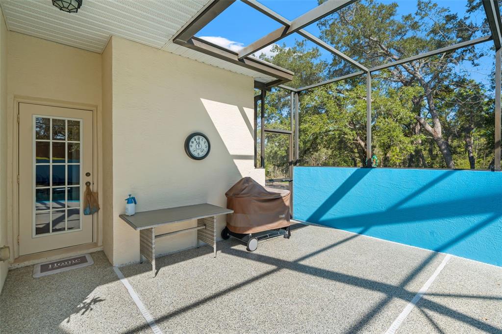 10288 Ridge Top Loop Weeki Wachee, FL 34613 - Photo 44 of 61 a view of a chairs and table in a patio