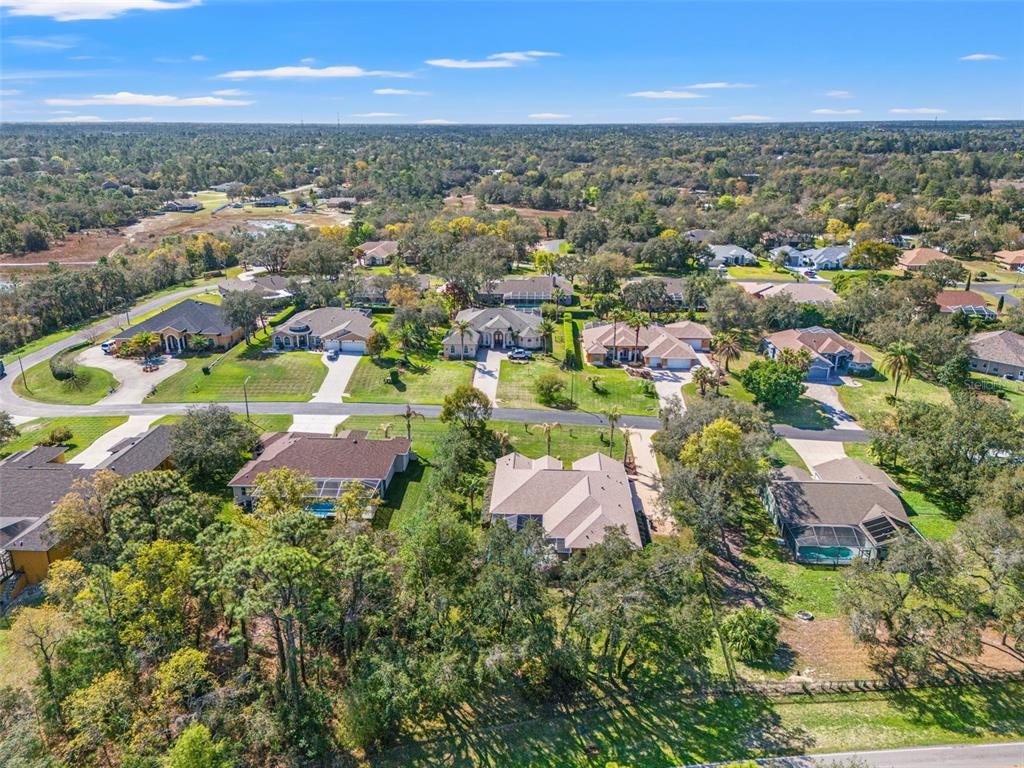 10288 Ridge Top Loop Weeki Wachee, FL 34613 - Photo 57 of 61 an aerial view of residential house with outdoor space