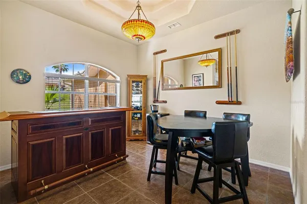 a view of a dining room and a table and chairs
