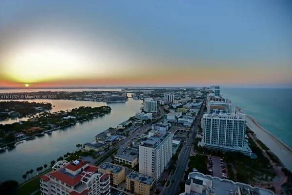 an aerial view of a house with lake view