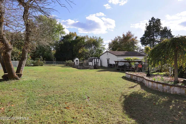 a swimming pool view with a seating space