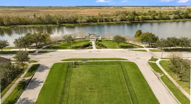 a view of a lake with a yard