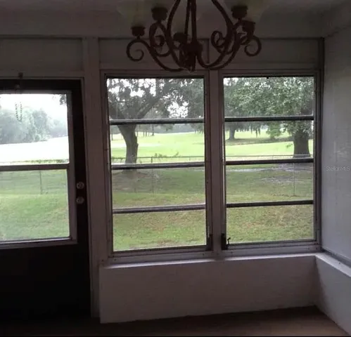 a view of a room that has a large window
