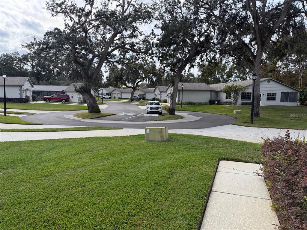 3818 River Oaks Court, Unit B New Port Richey, FL 34655 - Photo 4 of 7 a view of a house with a garden