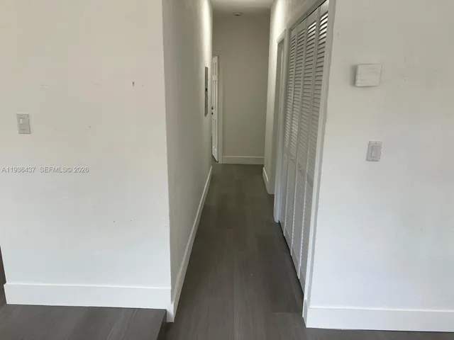 a view of a bathroom from a hallway