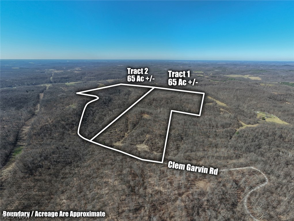Aerial view of property's location featuring property boundaries highlighted and a forest
