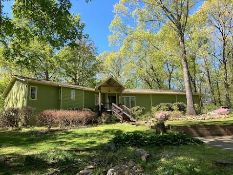 3195 Still Road Cumming, GA 30041 - Photo 1 of 1 a front view of house with garden and trees
