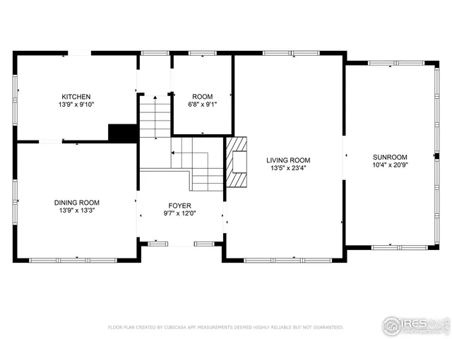 a picture of a wall with a white building in front of it