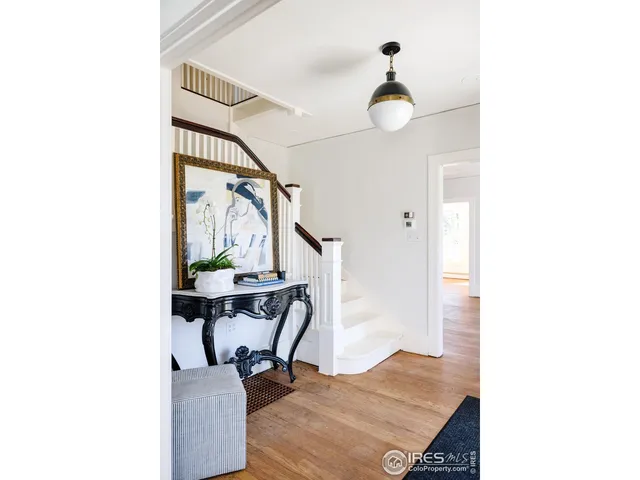 a view of a livingroom with furniture and a window