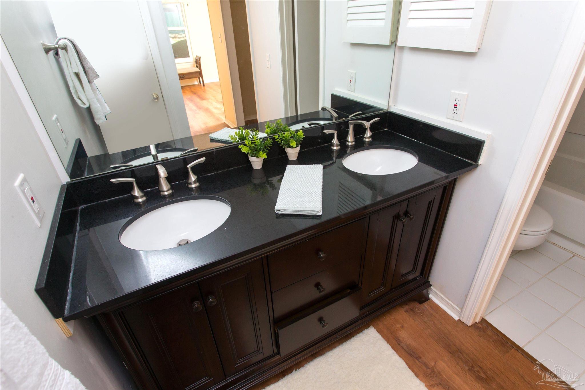 2299 Scenic Highway, Unit R10 Pensacola, FL 32503 - Photo 20 of 31 a bathroom with a sink and a mirror