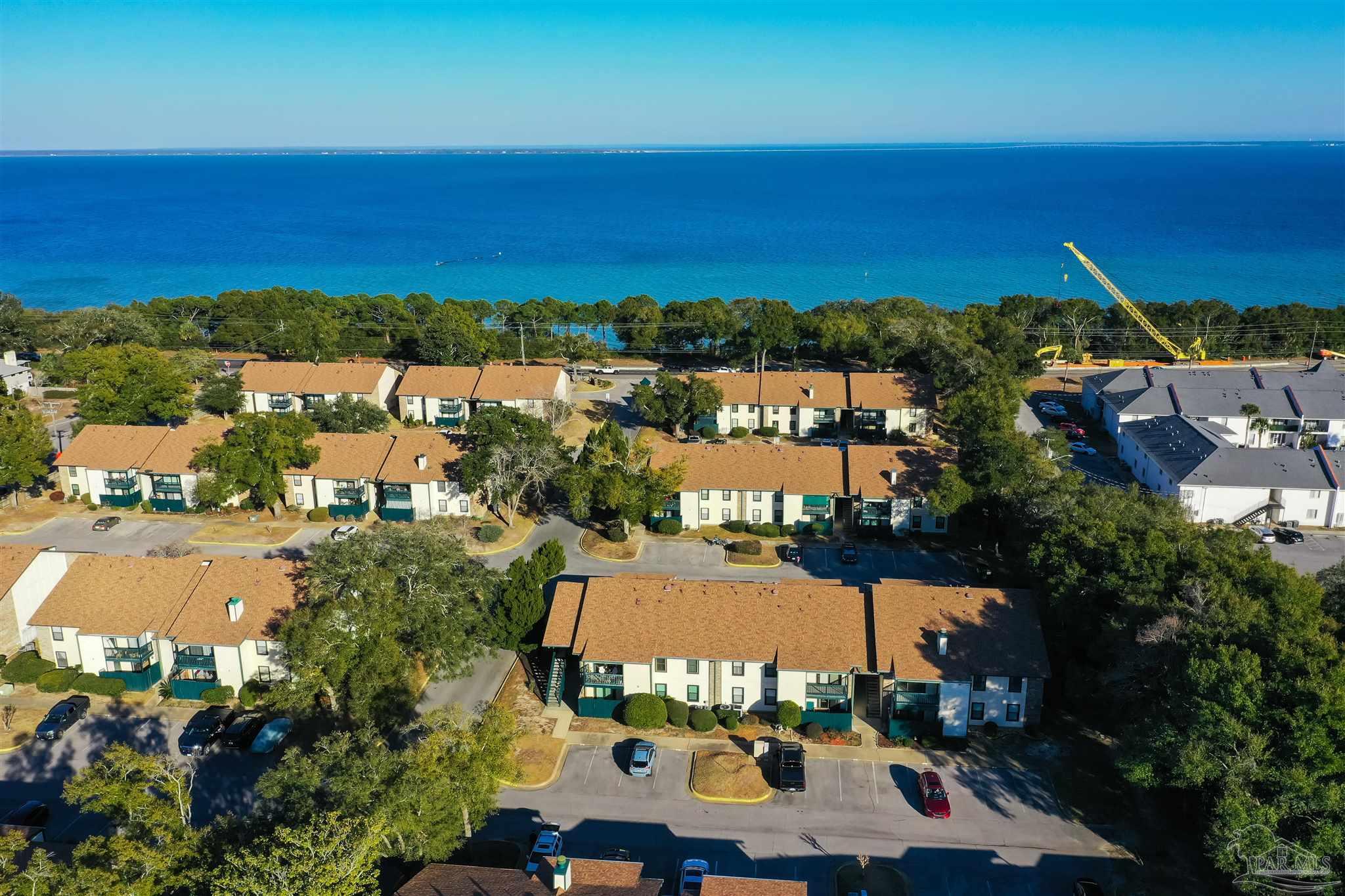 2299 Scenic Highway, Unit R10 Pensacola, FL 32503 - Photo 24 of 31 an aerial view of residential houses with outdoor space