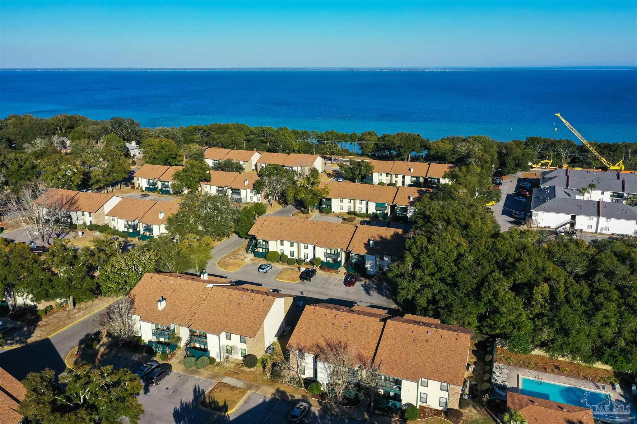 2299 Scenic Highway, Unit R10 Pensacola, FL 32503 - Photo 25 of 31 an aerial view of residential houses with outdoor space and ocean view