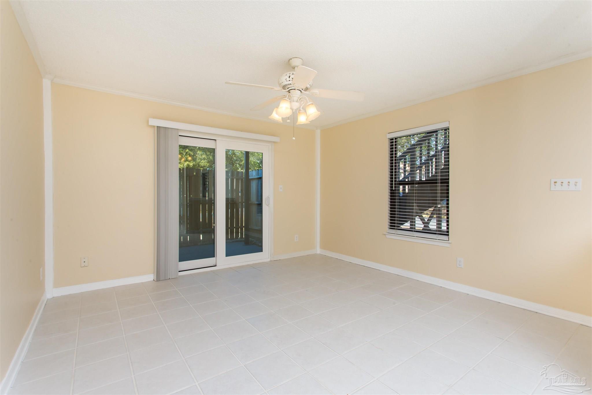 2299 Scenic Highway, Unit R10 Pensacola, FL 32503 - Photo 7 of 31 an empty room with windows and fan