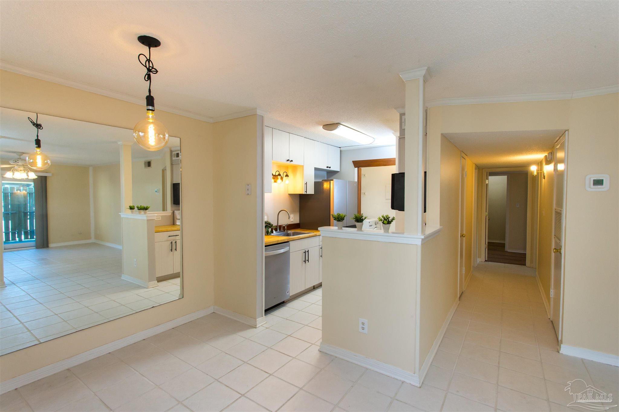 2299 Scenic Highway, Unit R10 Pensacola, FL 32503 - Photo 8 of 31 a view of a kitchen and a refrigerator in a room