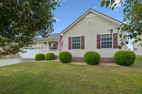 a front view of a house with a garage