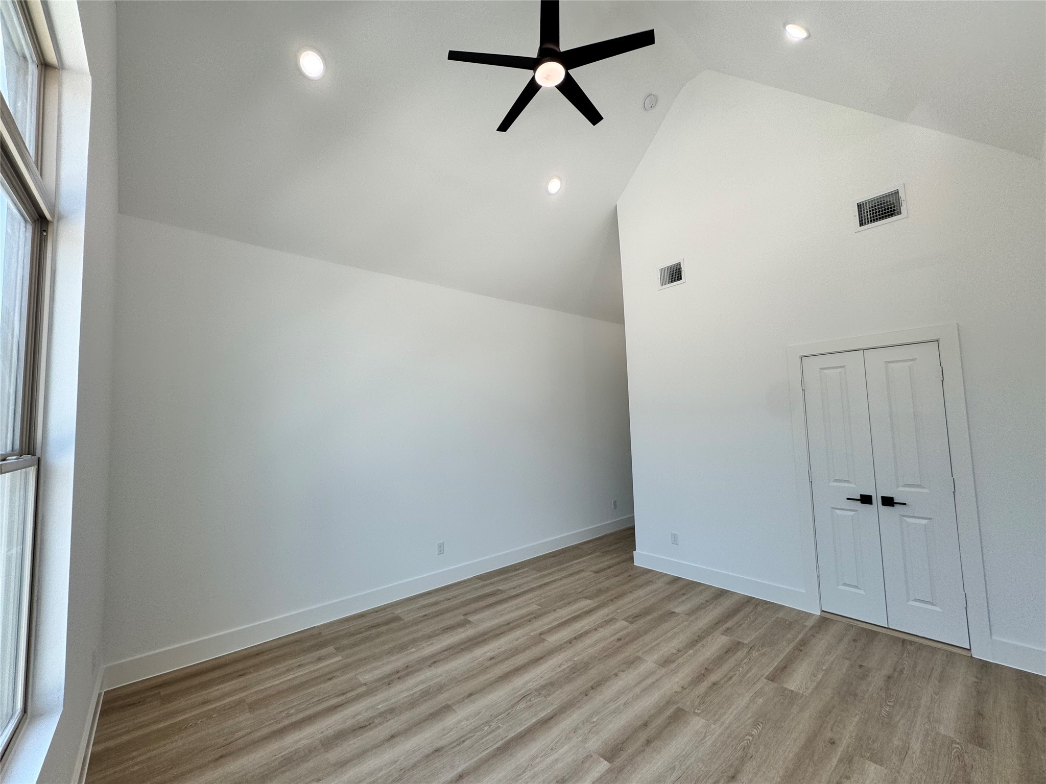 1506 Griffin Street Houston, TX 77009 - Photo 11 of 16 a view of a room with wooden floor and white walls