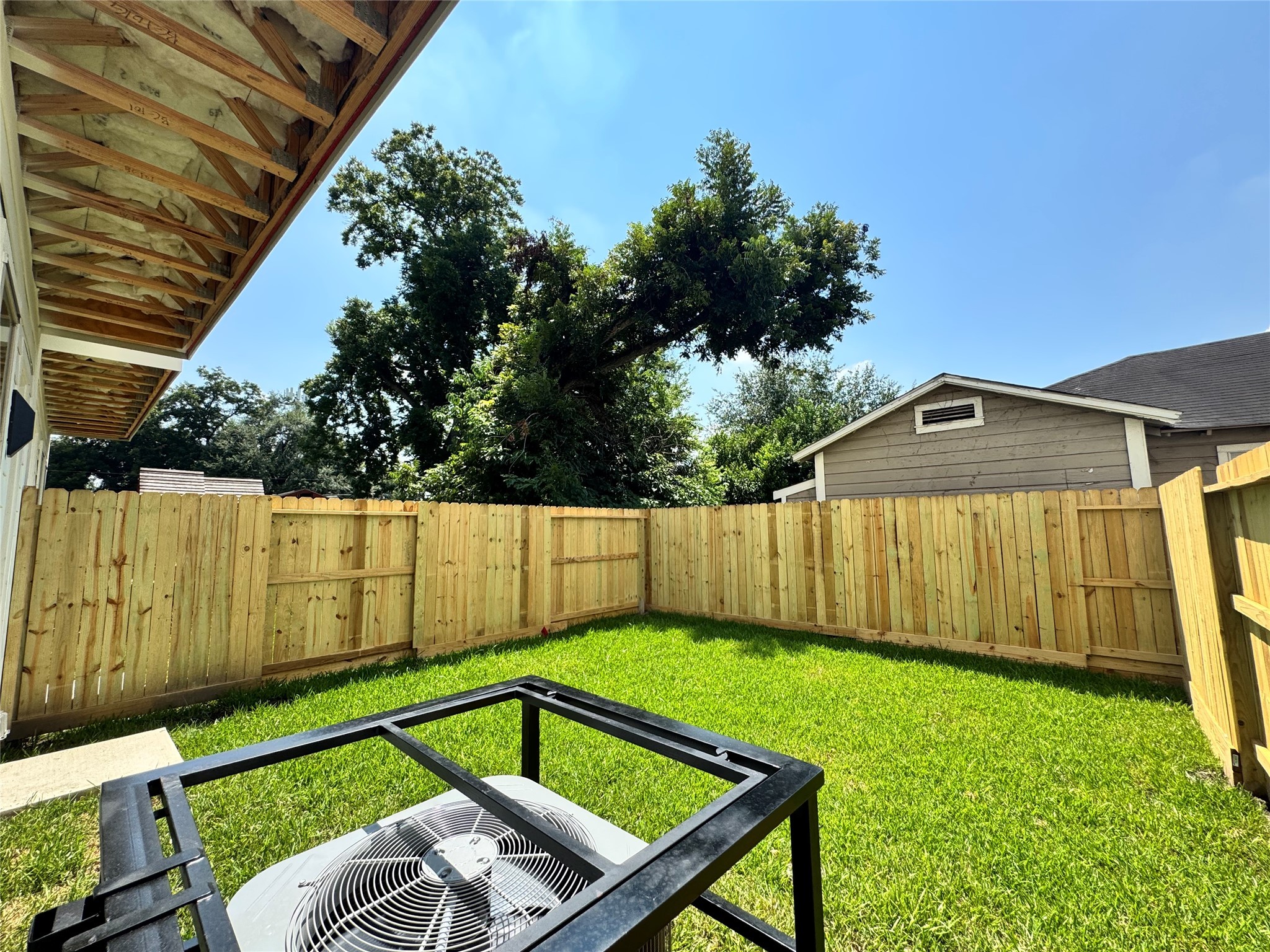 1506 Griffin Street Houston, TX 77009 - Photo 4 of 16 a view of a backyard with a small cabin