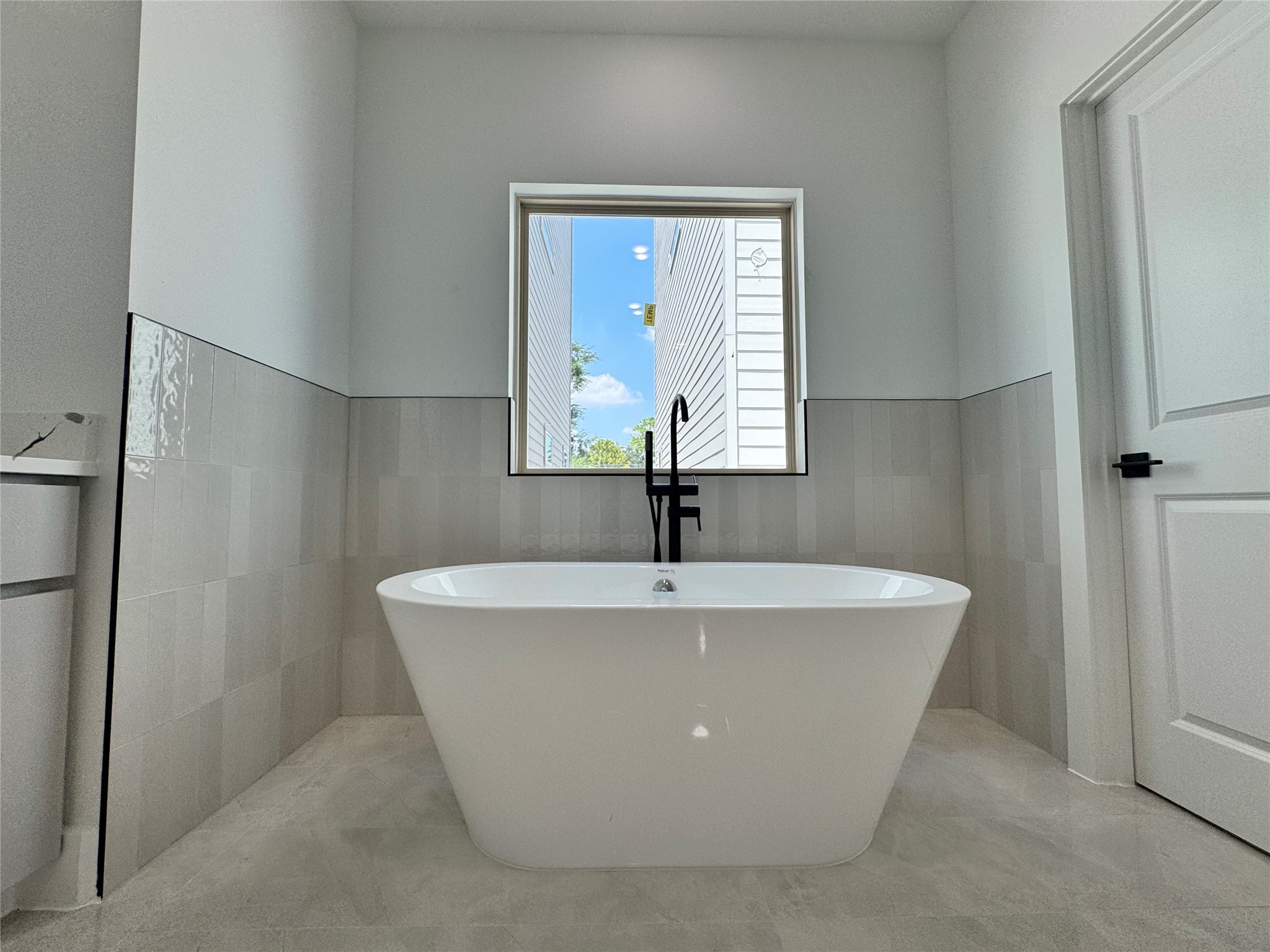 1506 Griffin Street Houston, TX 77009 - Photo 6 of 16 a white bath tub sitting in a bathroom