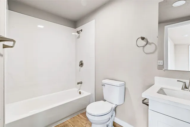 an empty room with a chandelier fan