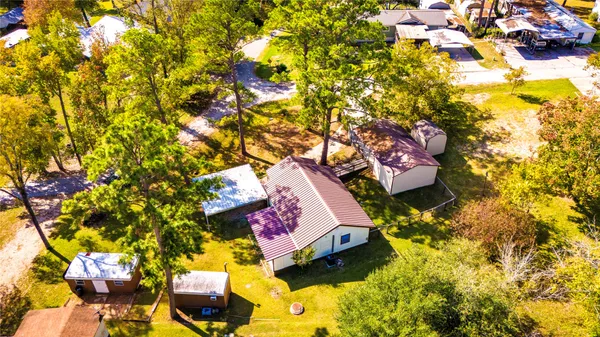 a view of a house with a yard porch and sitting area