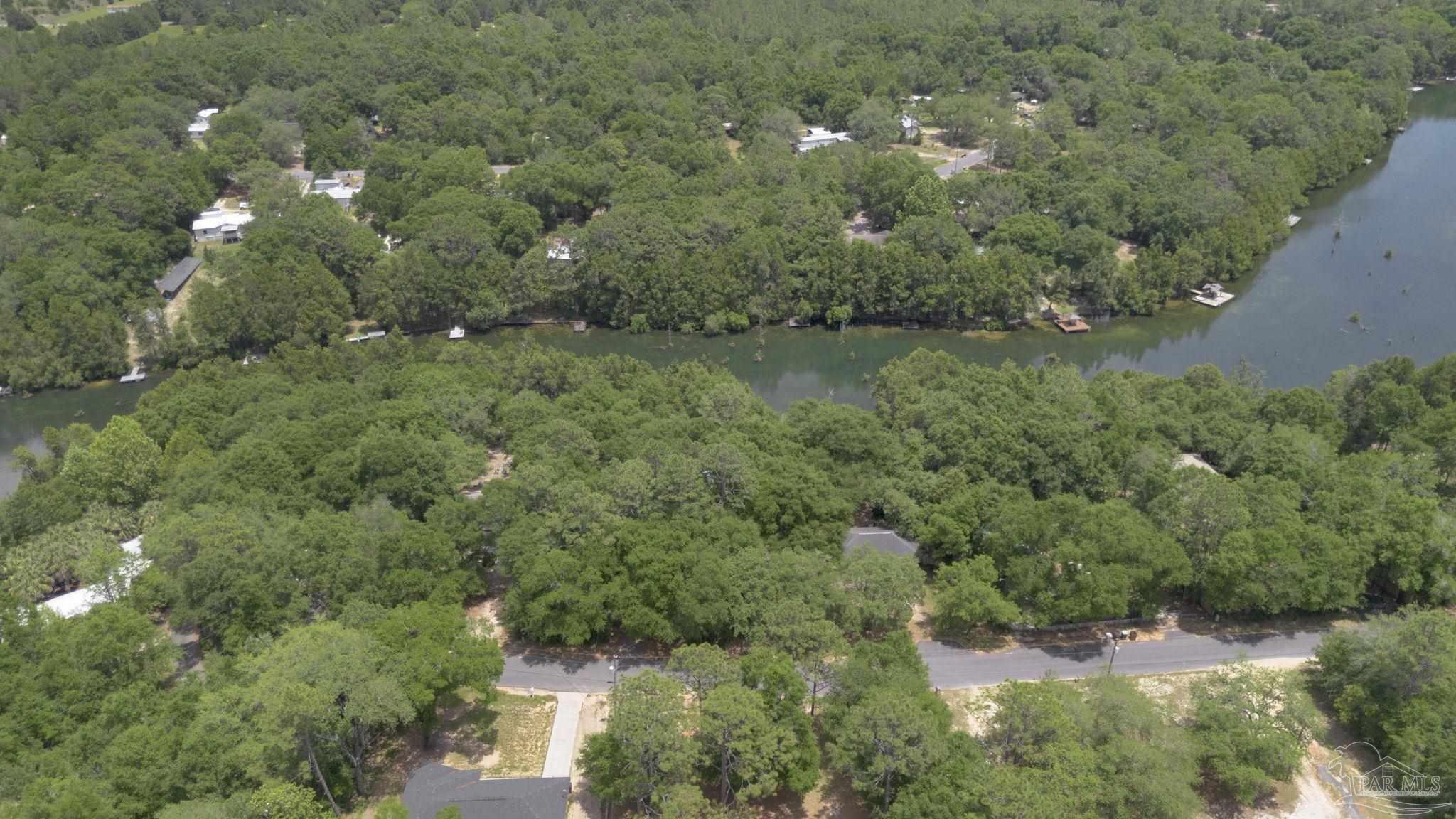 10290 West Lake Road Milton, FL 32583 - Photo 48 of 53 an aerial view of residential house with outdoor space and trees all around