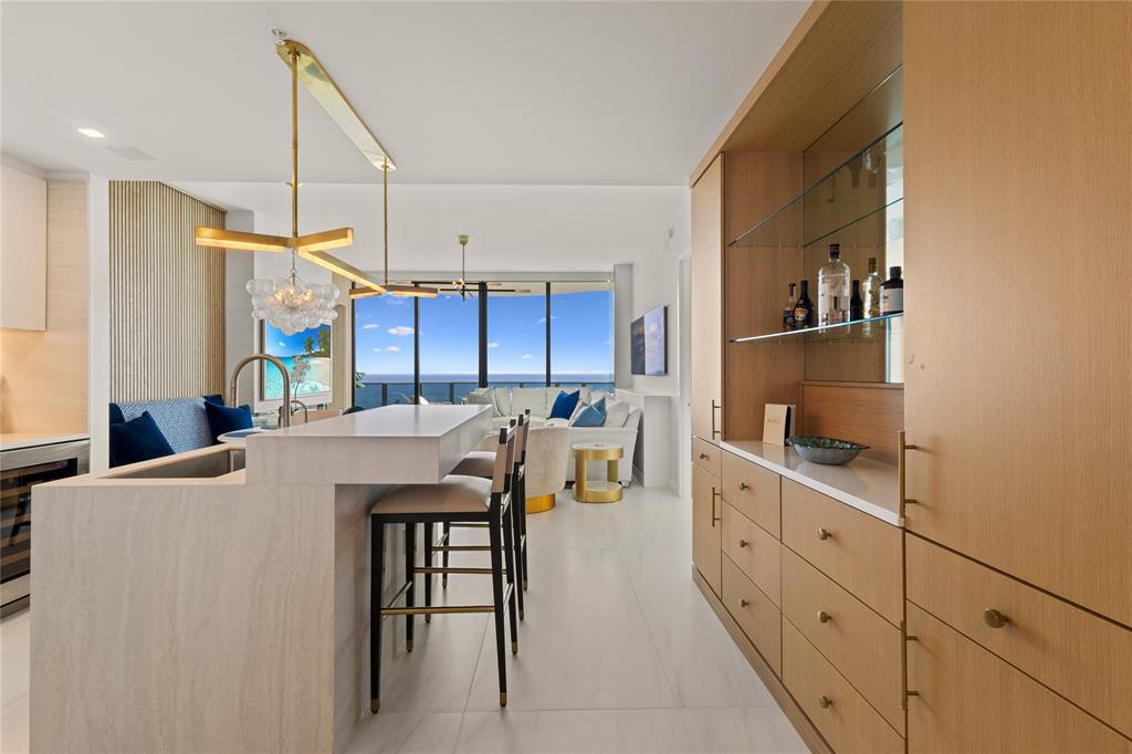 900 North Ocean Boulevard, Unit LPH05 Pompano Beach, FL 33062 - Photo 15 of 69 a kitchen that has a cabinets a sink and a stove