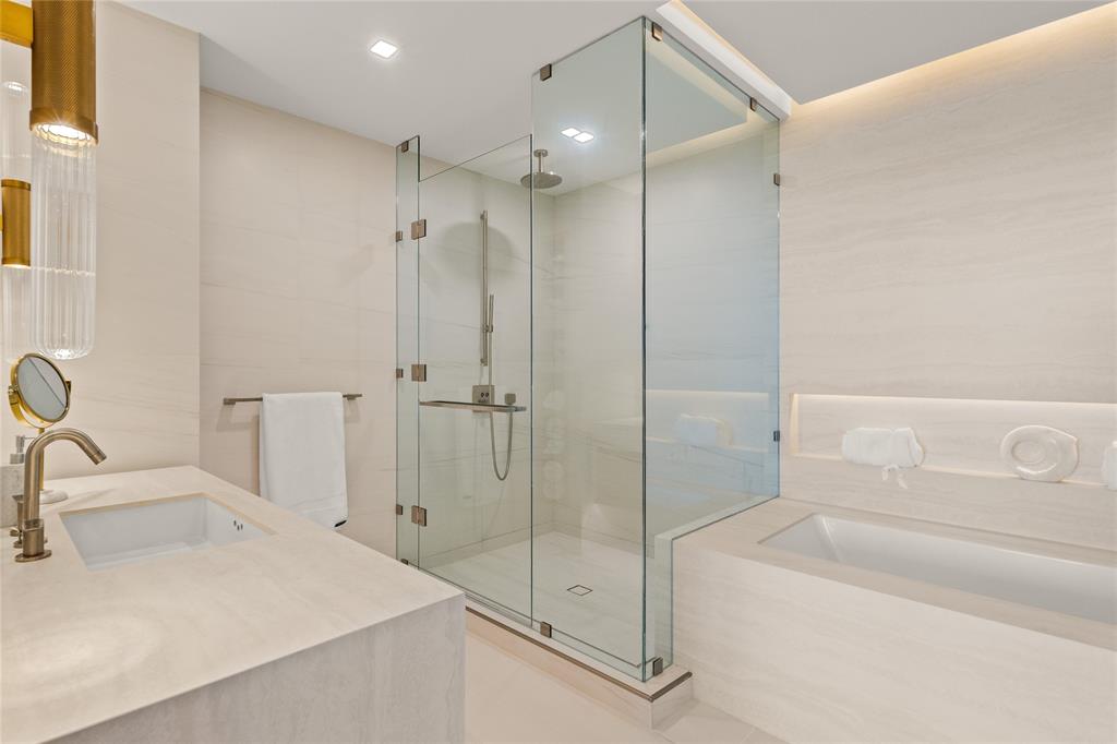 900 North Ocean Boulevard, Unit LPH05 Pompano Beach, FL 33062 - Photo 22 of 69 a bathroom with a sink a toilet and shower