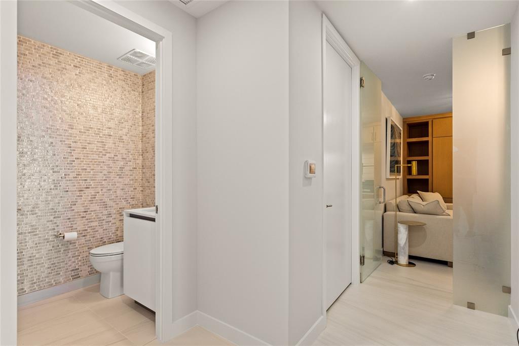 900 North Ocean Boulevard, Unit LPH05 Pompano Beach, FL 33062 - Photo 29 of 69 1/2 bath, Den, 3rd bedroom/office with privacy glass enclosure door