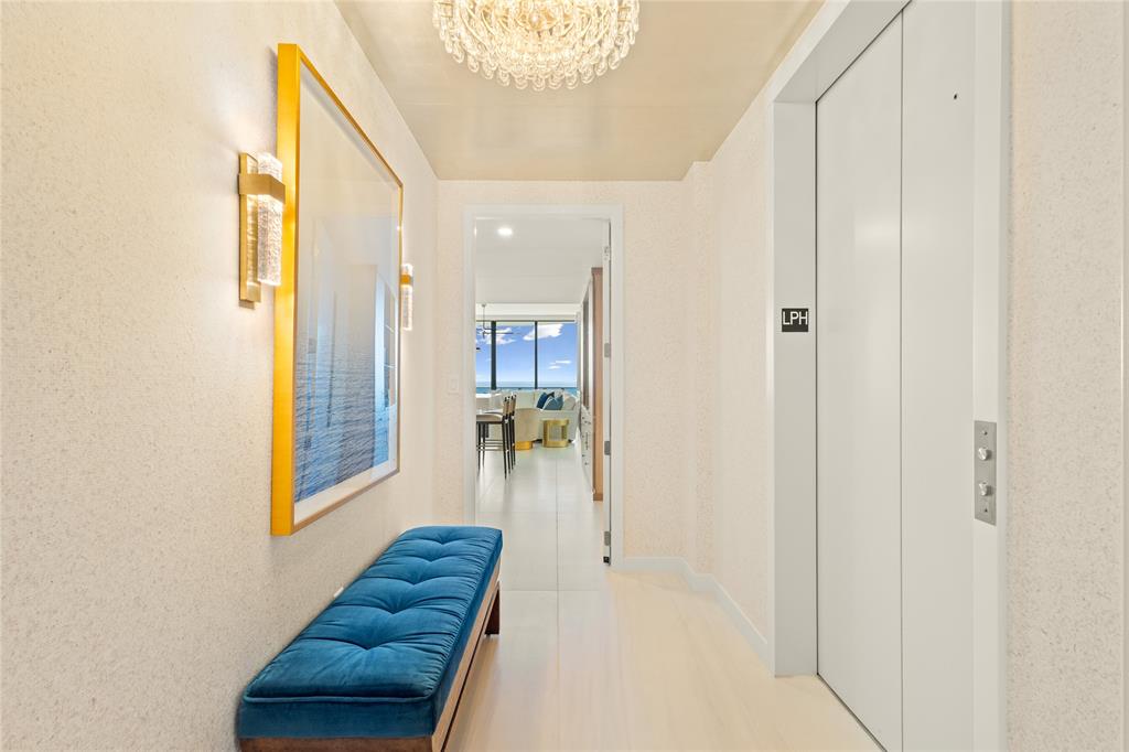 900 North Ocean Boulevard, Unit LPH05 Pompano Beach, FL 33062 - Photo 30 of 69 a view of hallway with a large mirror and a shower