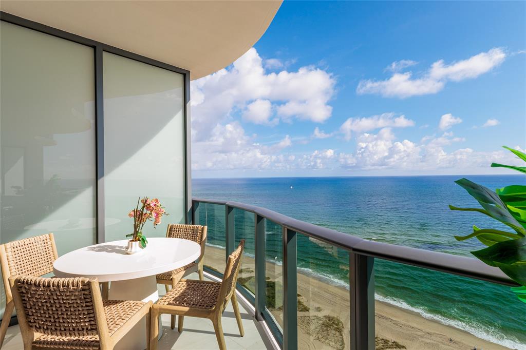 900 North Ocean Boulevard, Unit LPH05 Pompano Beach, FL 33062 - Photo 3 of 69 a view of a balcony dining table and chairs