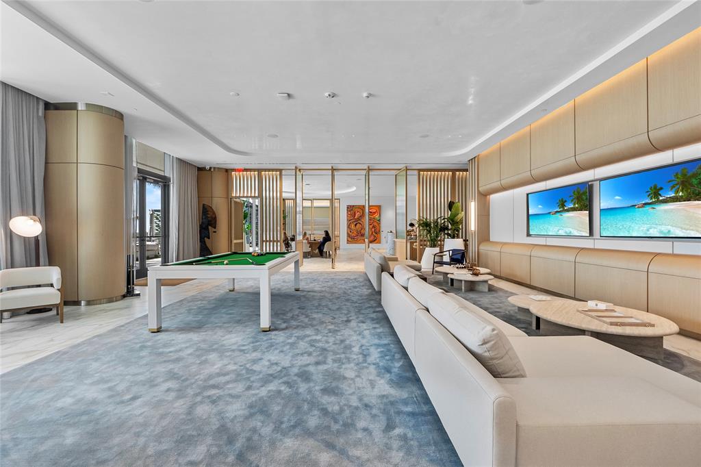 900 North Ocean Boulevard, Unit LPH05 Pompano Beach, FL 33062 - Photo 33 of 69 a living room with furniture and a flat screen tv