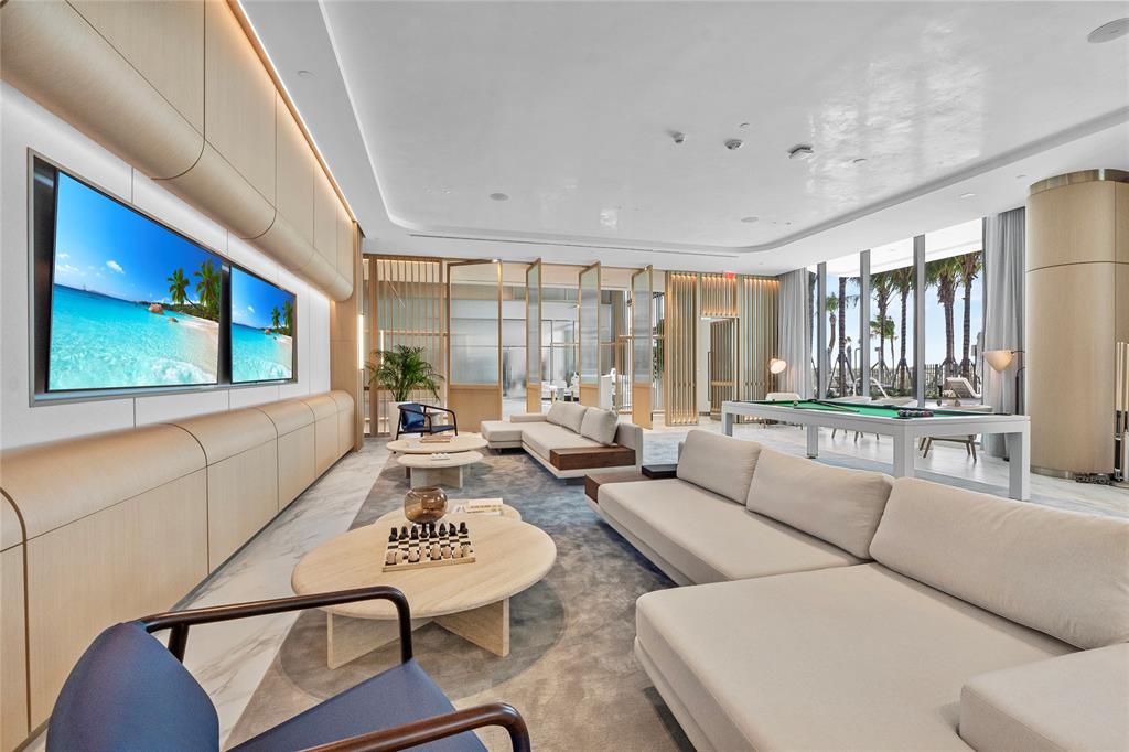 900 North Ocean Boulevard, Unit LPH05 Pompano Beach, FL 33062 - Photo 34 of 69 a living room with furniture and a large window