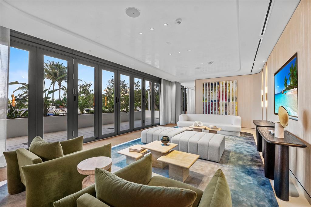 900 North Ocean Boulevard, Unit LPH05 Pompano Beach, FL 33062 - Photo 49 of 69 a living room with furniture and a flat screen tv