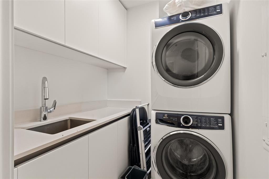 900 North Ocean Boulevard, Unit LPH05 Pompano Beach, FL 33062 - Photo 68 of 69 a utility room with dryer and washer