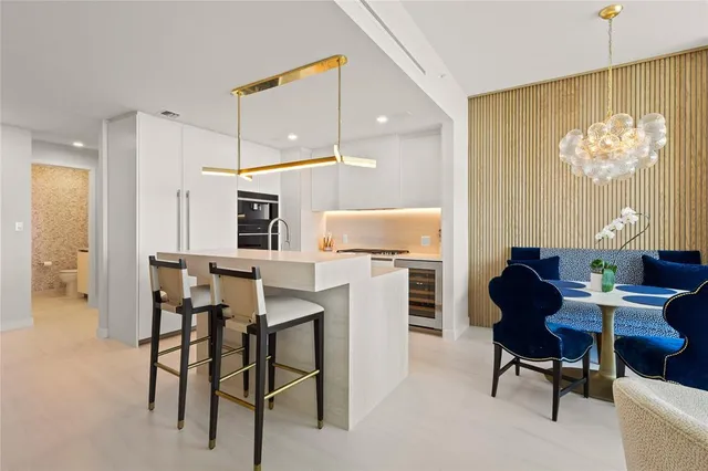 a kitchen that has a cabinets a sink and a stove