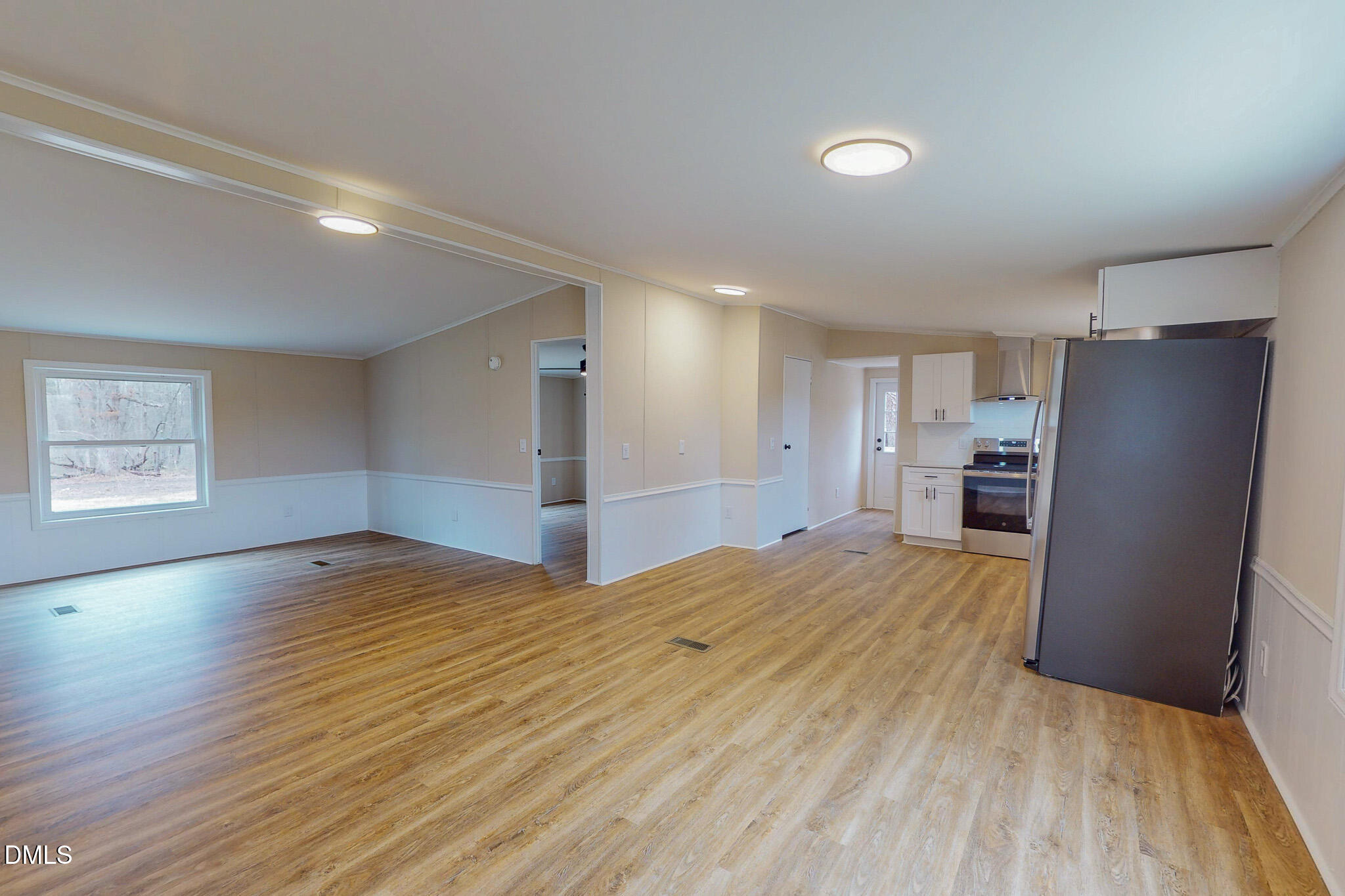 67 Halifax Road Roxboro, NC 27574 - Photo 8 of 48 a view of empty room with wooden floor and window