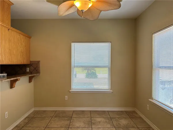 a view of a room that has a window in it