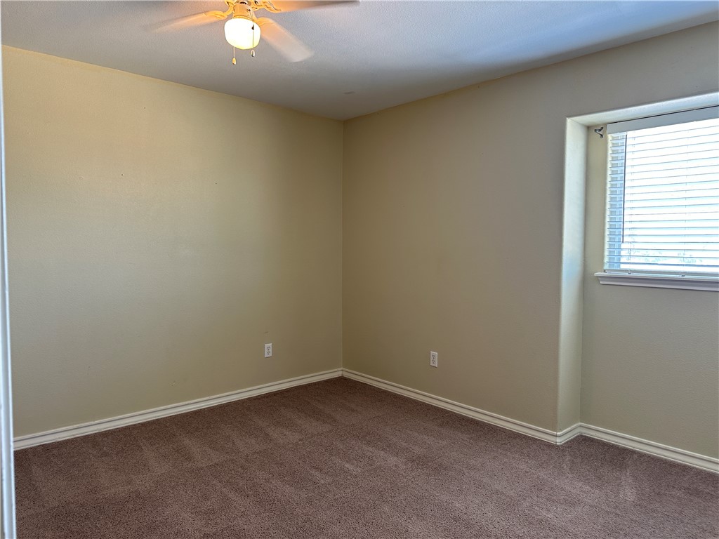 14010 Ambrosia Street, Unit A Corpus Christi, TX 78418 - Photo 10 of 13 an empty room with a window