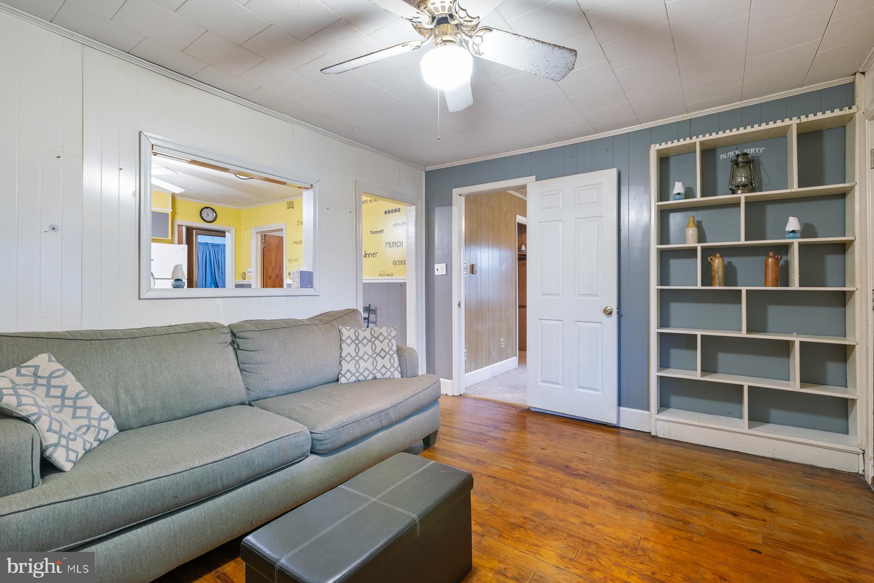21610 Slidell Road Boyds, MD 20841 - Photo 4 of 25 a living room with furniture and a chandelier