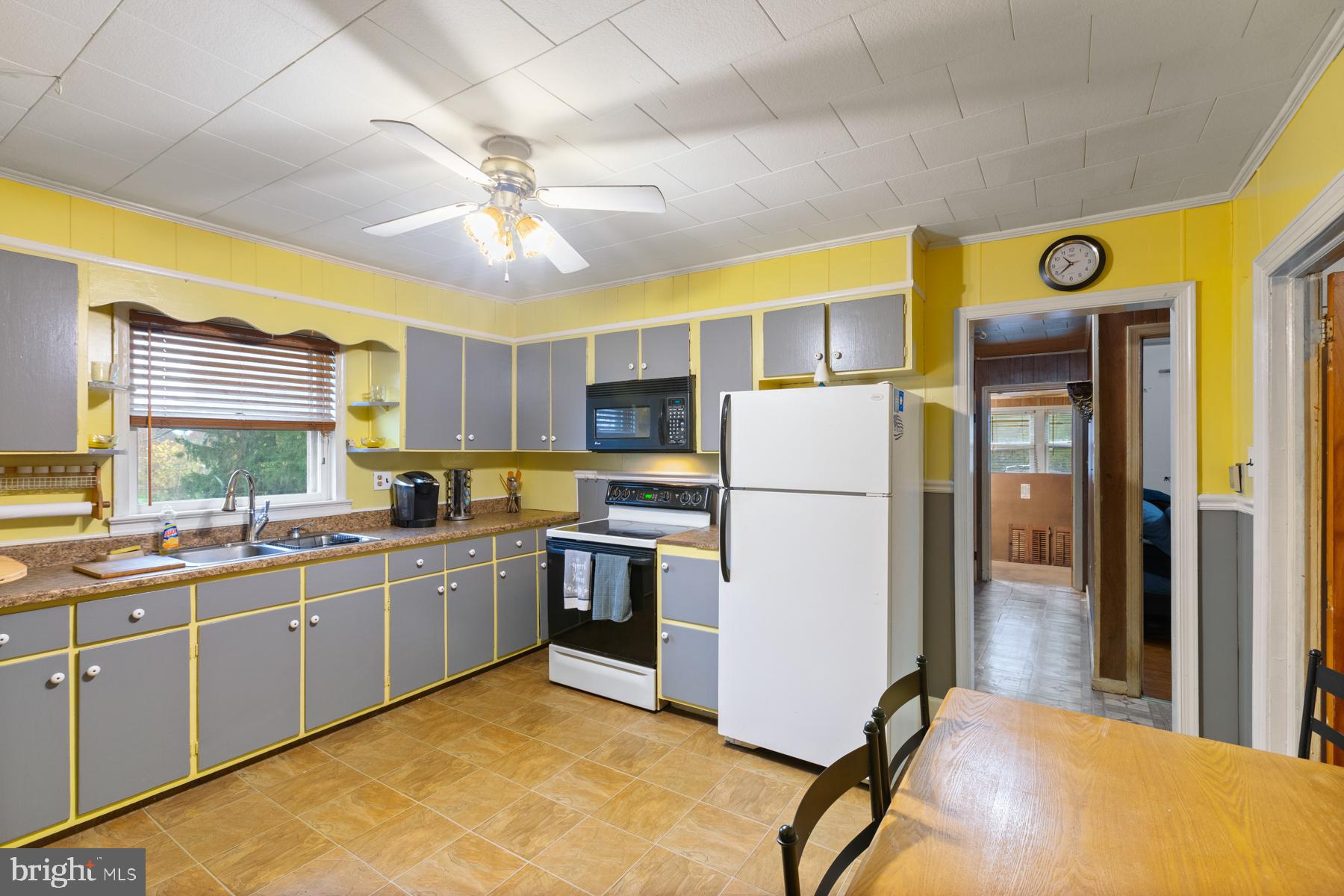 21610 Slidell Road Boyds, MD 20841 - Photo 7 of 25 a kitchen a refrigerator a sink and cabinets