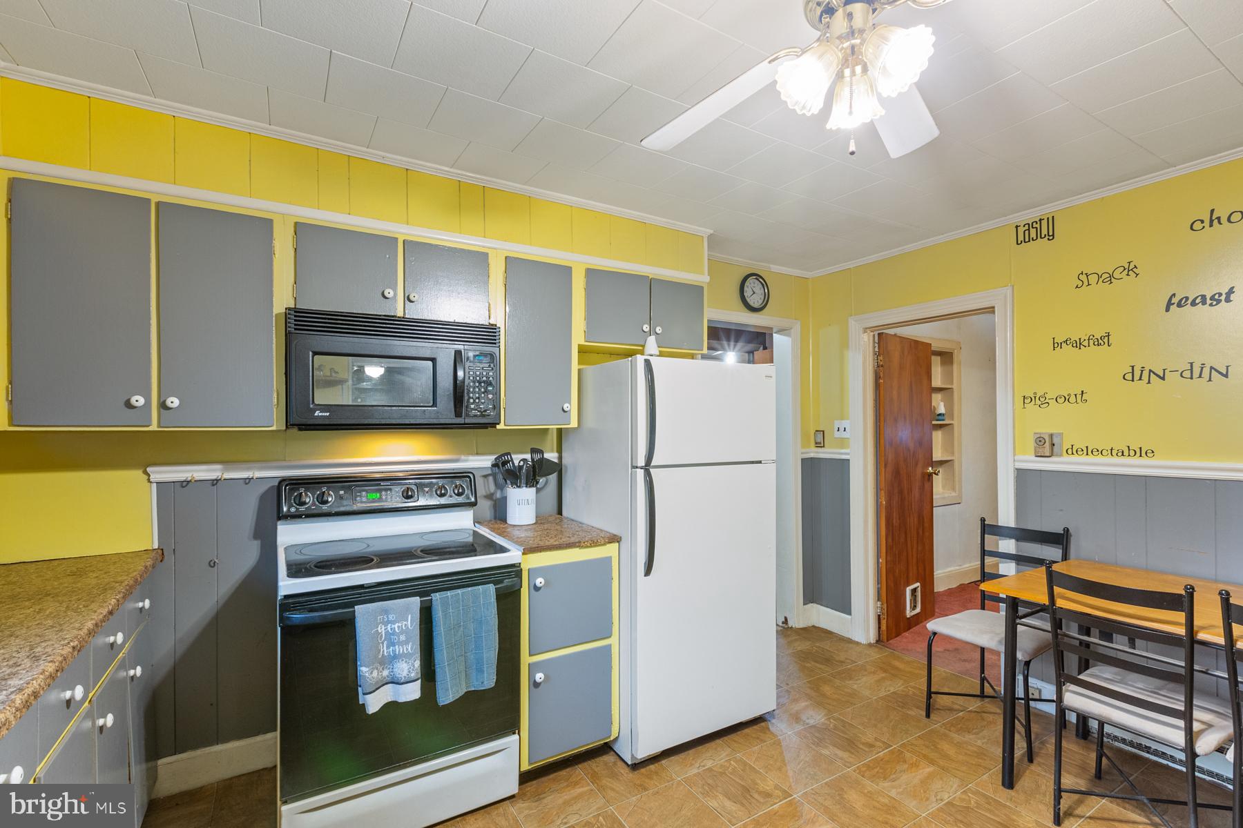 21610 Slidell Road Boyds, MD 20841 - Photo 8 of 25 a kitchen with a refrigerator and a stove top oven
