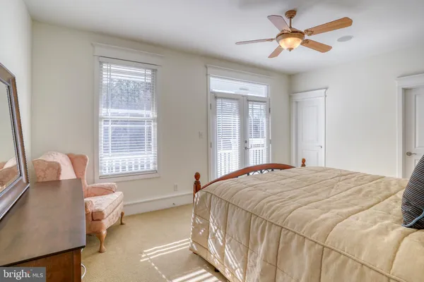 a bathroom with a bathtub a double vanity sink and shower