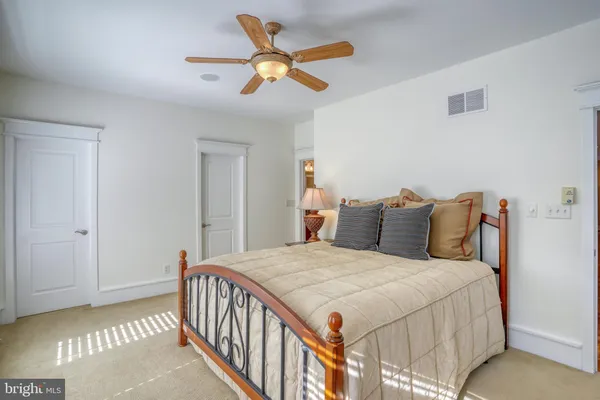 a view of a room with wooden floor and staircase