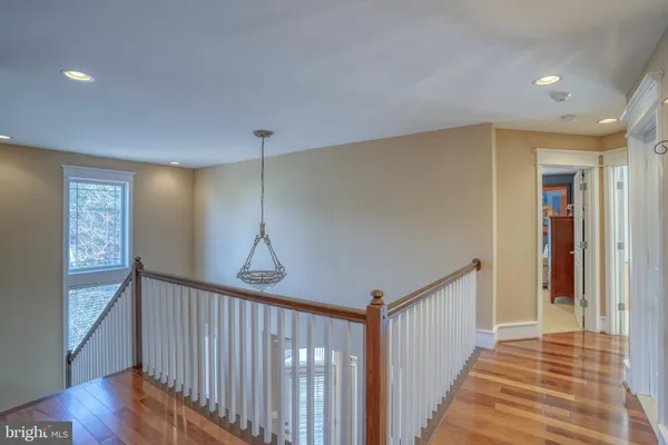 a view of balcony with wooden floor