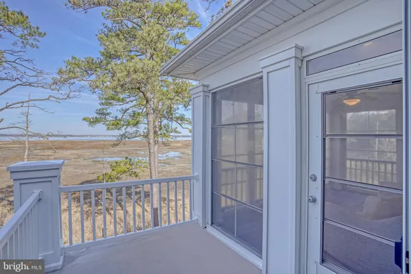 a room with pool table and windows