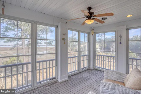 a room with pool table and a chandelier