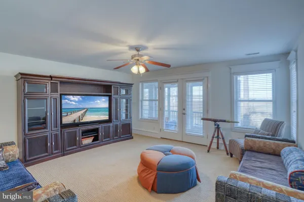 a view of a swimming pool and an outdoor seating